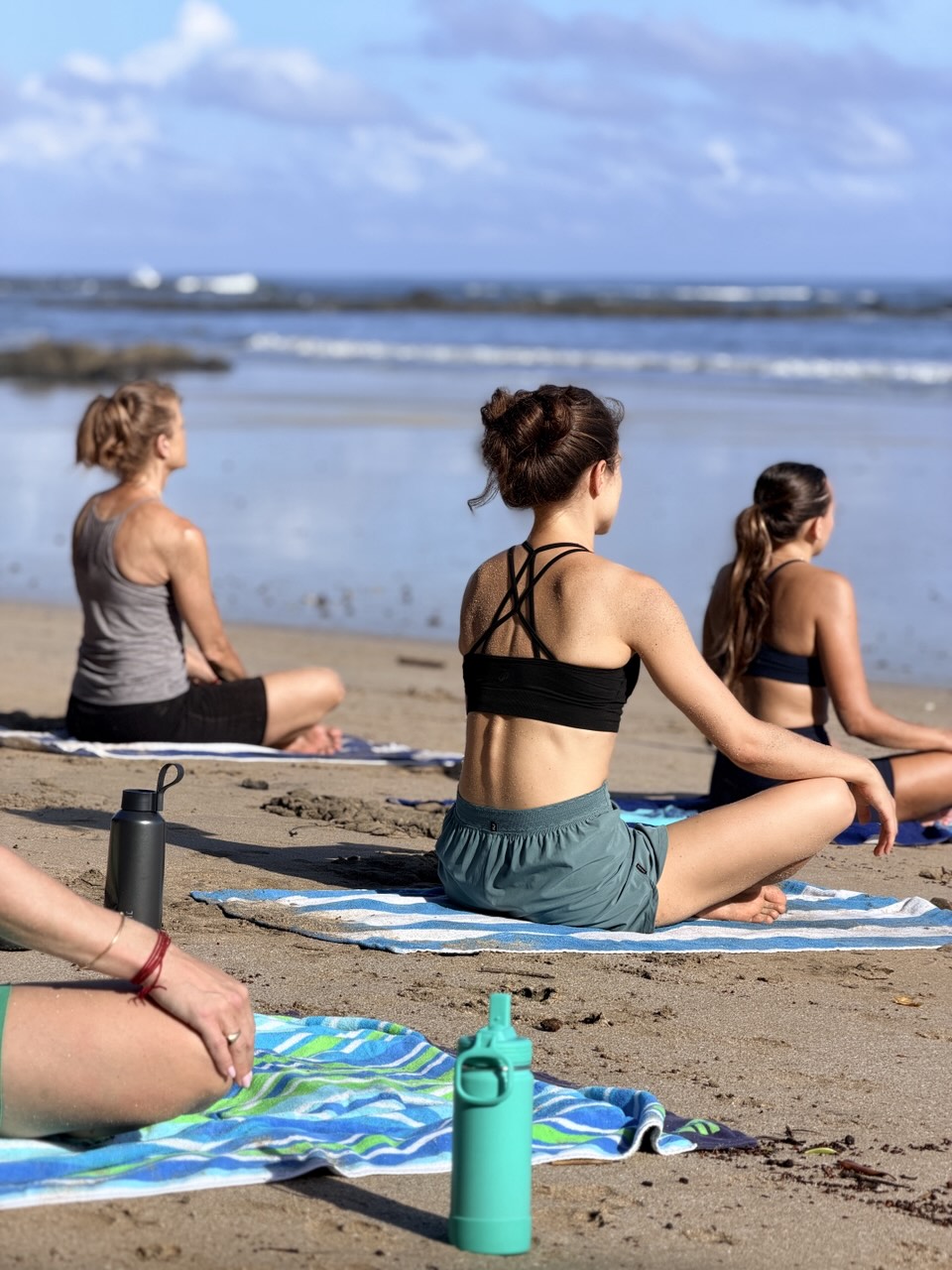 Beach yoga class at a Five Parks retreat in Costa Rica