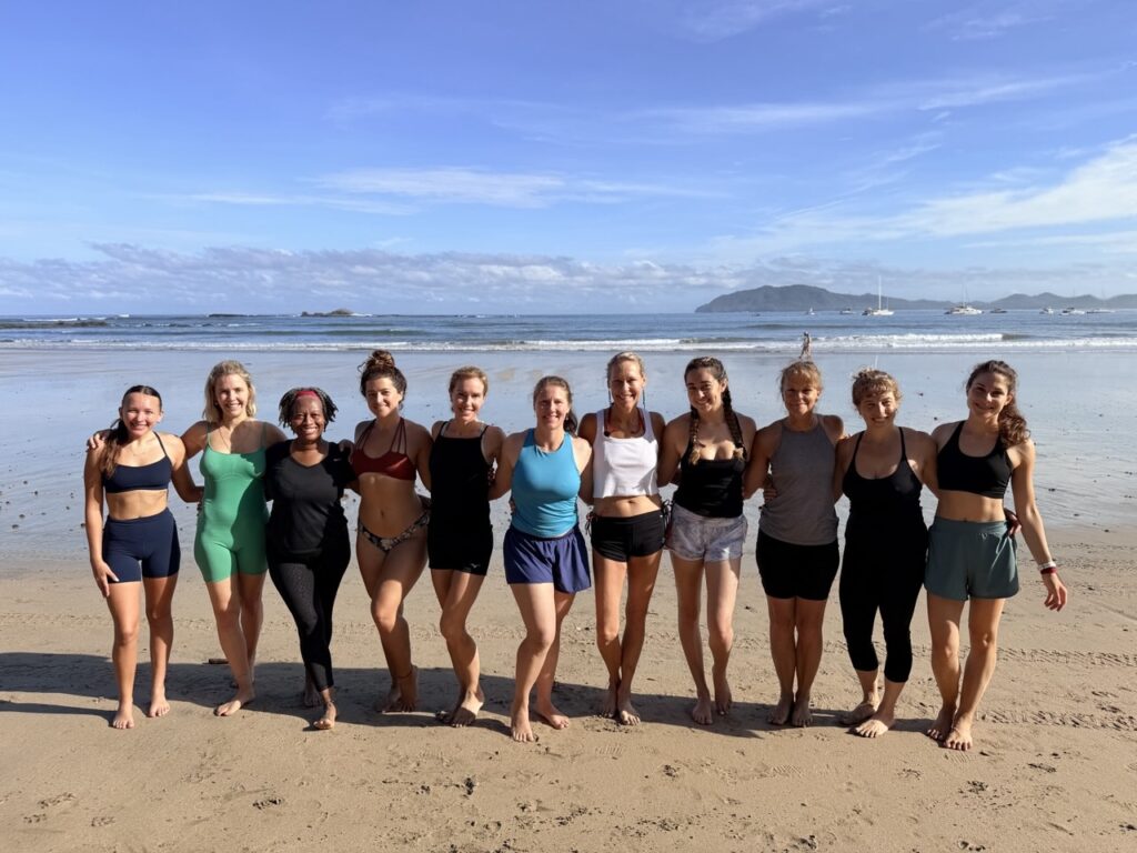 A retreat group together on the beach