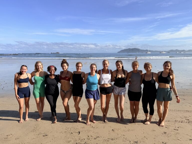 A retreat group together on the beach
