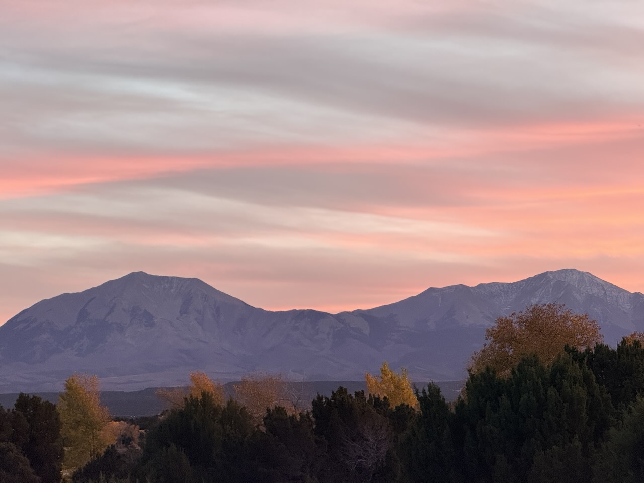 Pink evening sky over mountain peaks